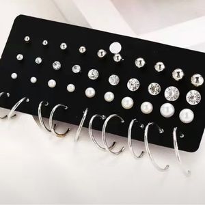 Faux pearl and silvery hoop set.